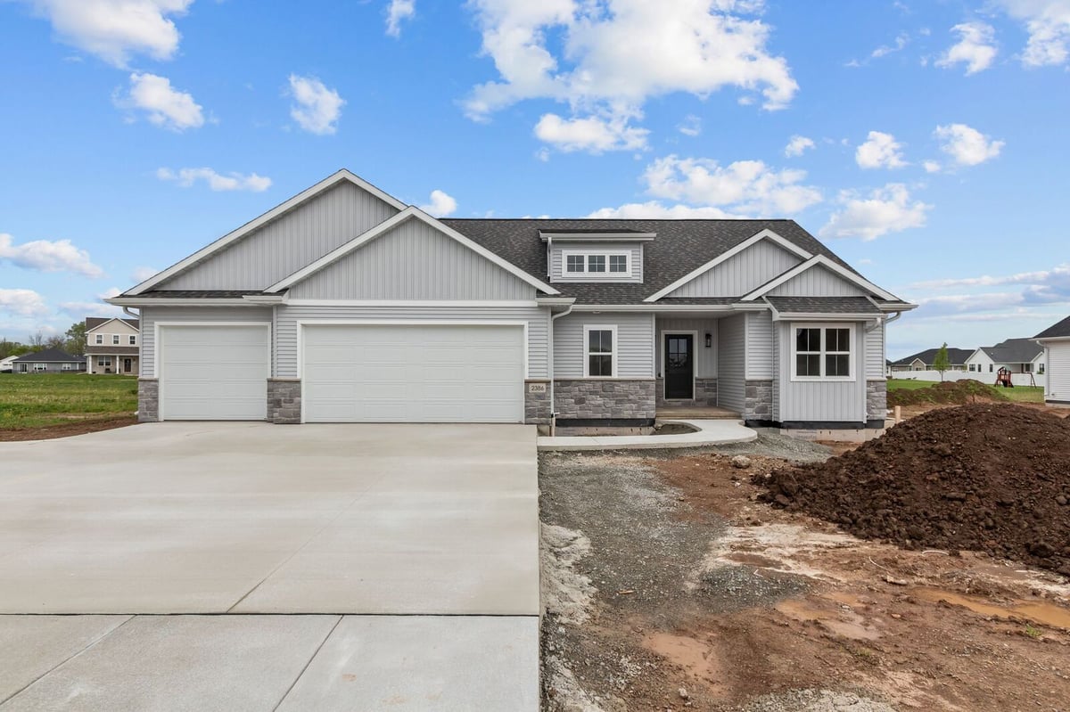 Front elevation of modern ranch-style home under construction in Northern Wisconsin