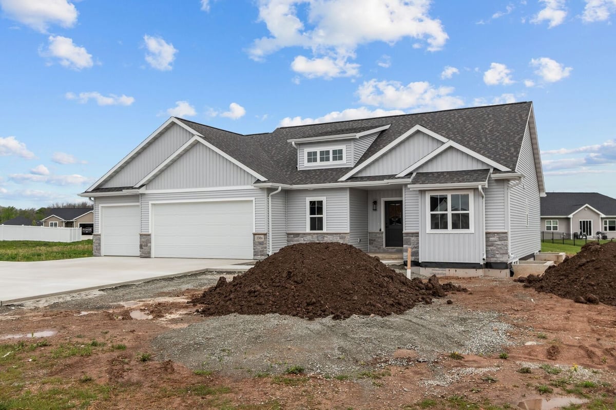 Front exterior of new construction ranch home with three-car garage in Northern Wisconsin