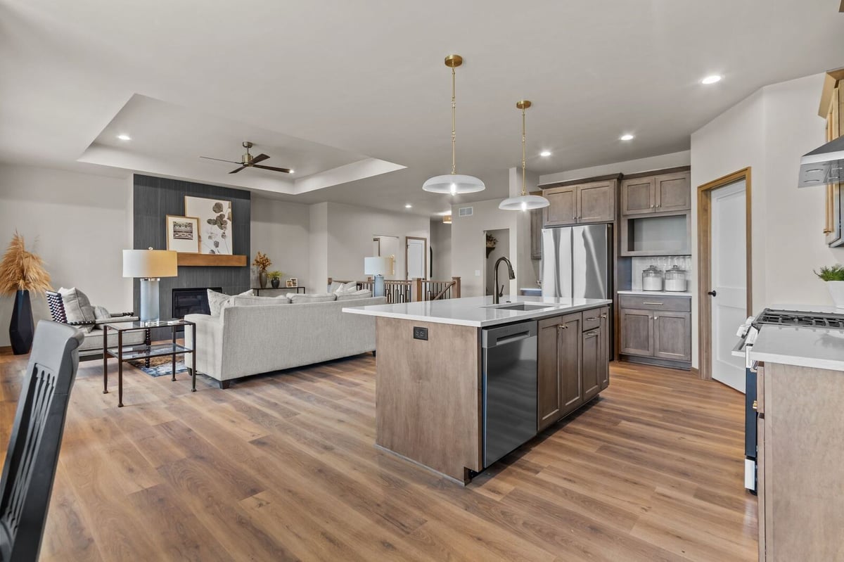 Open-concept kitchen and living area with oversized island in a Northern Wisconsin custom home