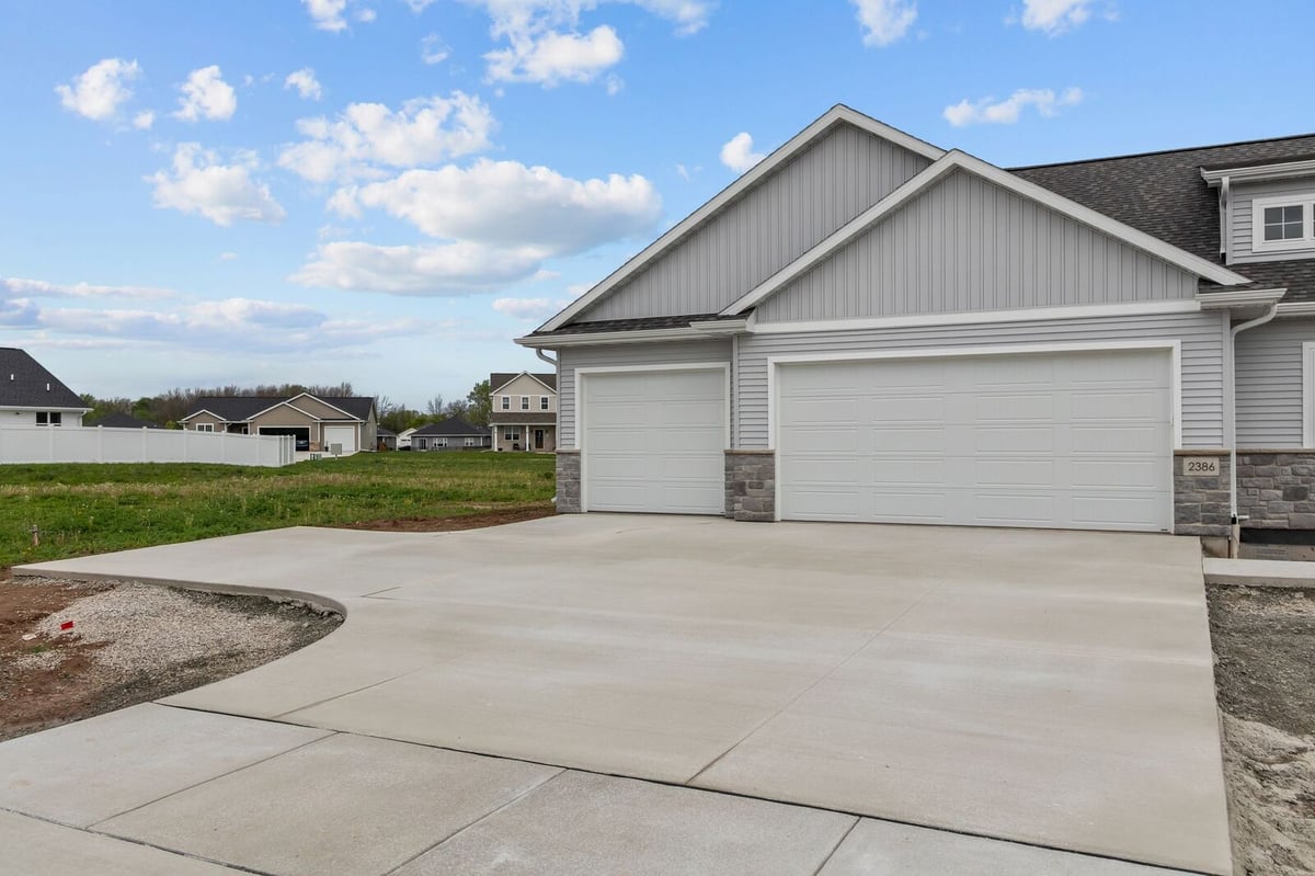 Three-car garage and driveway exterior of a new Northern Wisconsin home