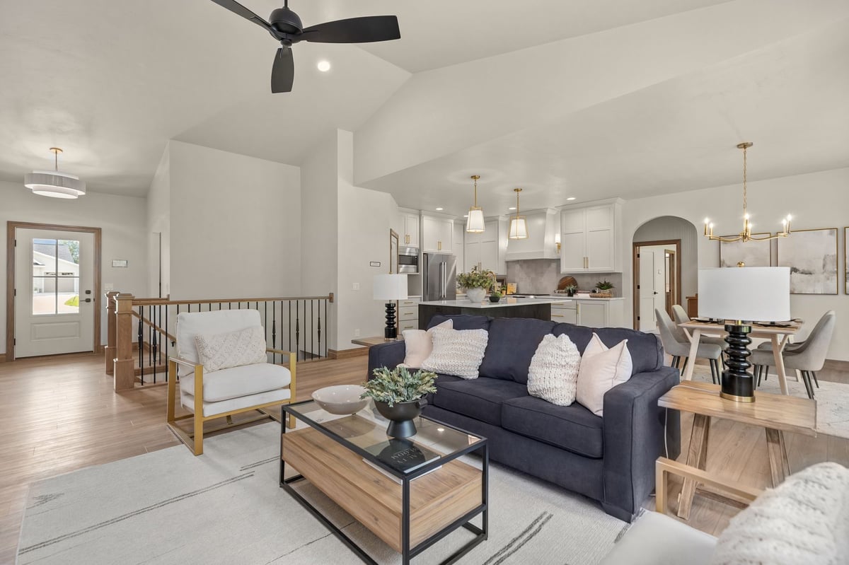 Open-concept living room with vaulted ceiling, kitchen and dining area in a Northeast Wisconsin home