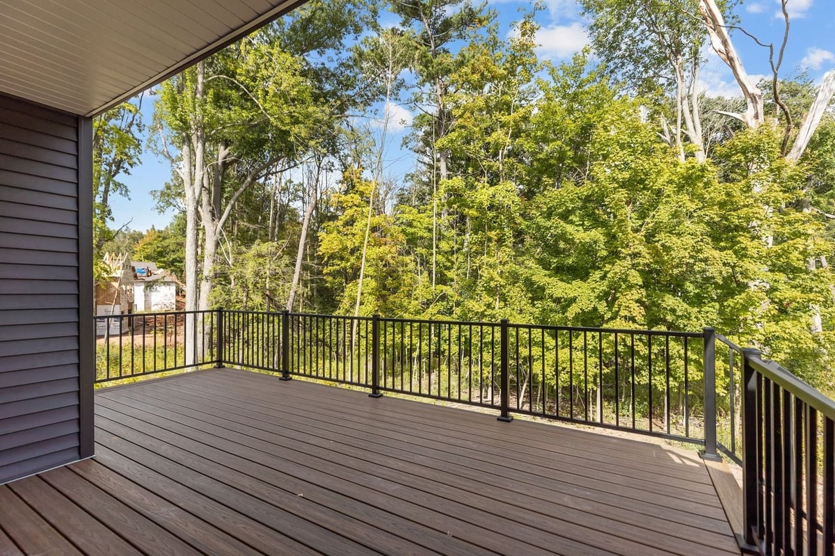 Spacious backyard deck overlooking a wooded area at a Northeast Wisconsin home