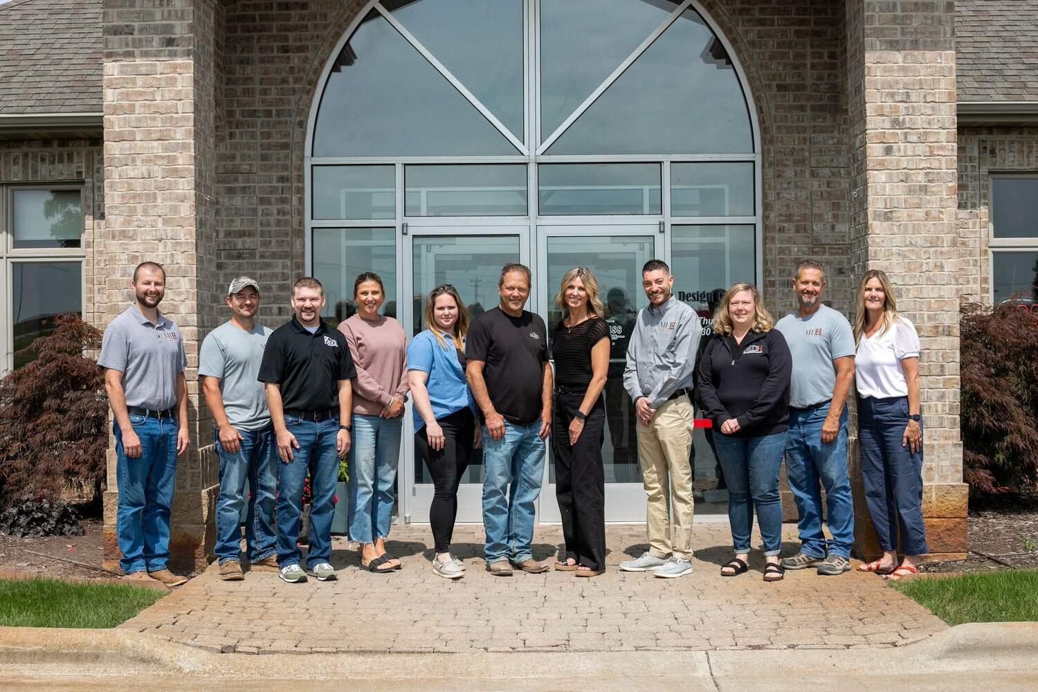 Exterior photo of MDH team by headquarters in Green Bay, WI for custom home projects