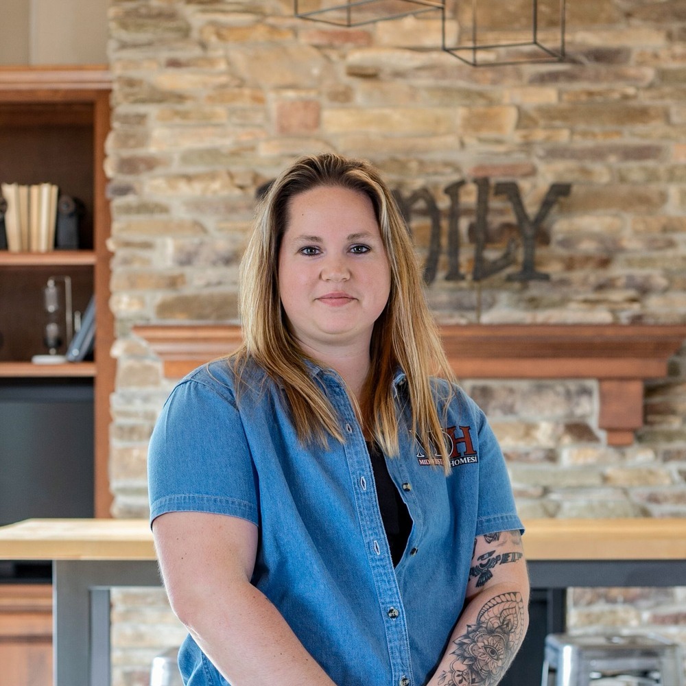 Midwest Design Homes woman team member inside custom home in Neenah, WI