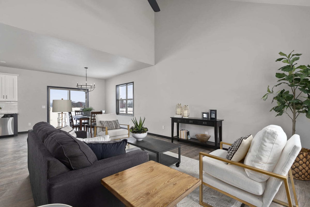 Modern open-concept living room with high ceilings and neutral decor in the Fox Cities