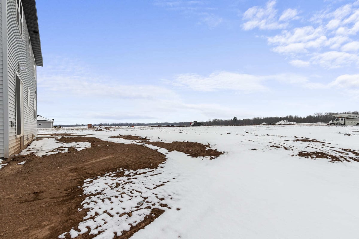 Snowy Fox Cities backyard with expansive views