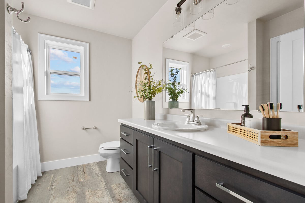 Clean and bright bathroom with natural light in a custom home by Midwest Design Homes in Harrison, WI