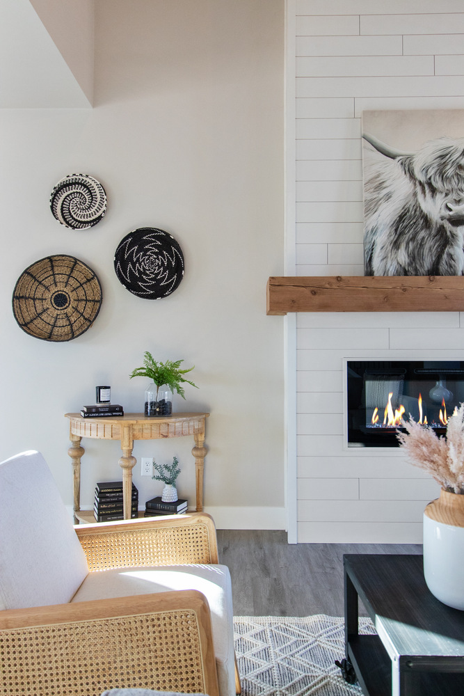 Cozy living room fireplace and wall decor in a Midwest Design Homes custom home in Harrison, WI