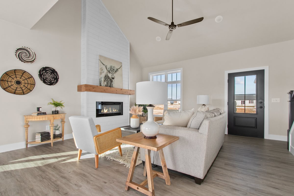Cozy living room with fireplace and eclectic decor in custom home by Midwest Design Homes in Fox Cities, WI