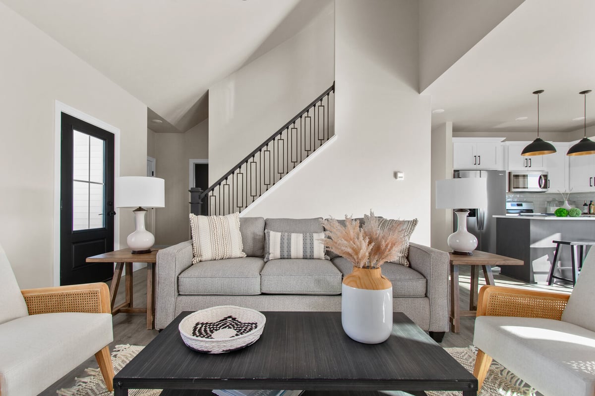 Cozy living room with neutral sofa and modern decor by Midwest Design Homes in Kaukauna, WI
