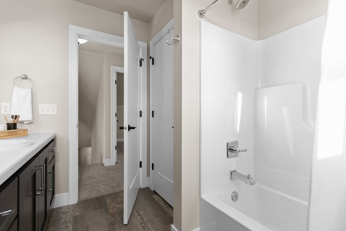 Full bathroom with shower and vanity in a Midwest Design Homes custom home in Kaukauna, WI