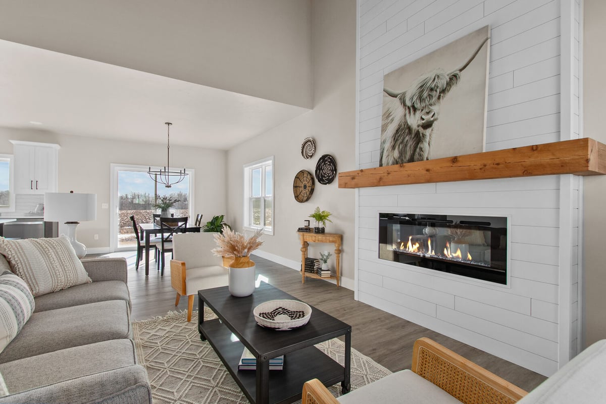 Living room with cozy fireplace and decorative accents by Midwest Design Homes in Fox Cities, WI