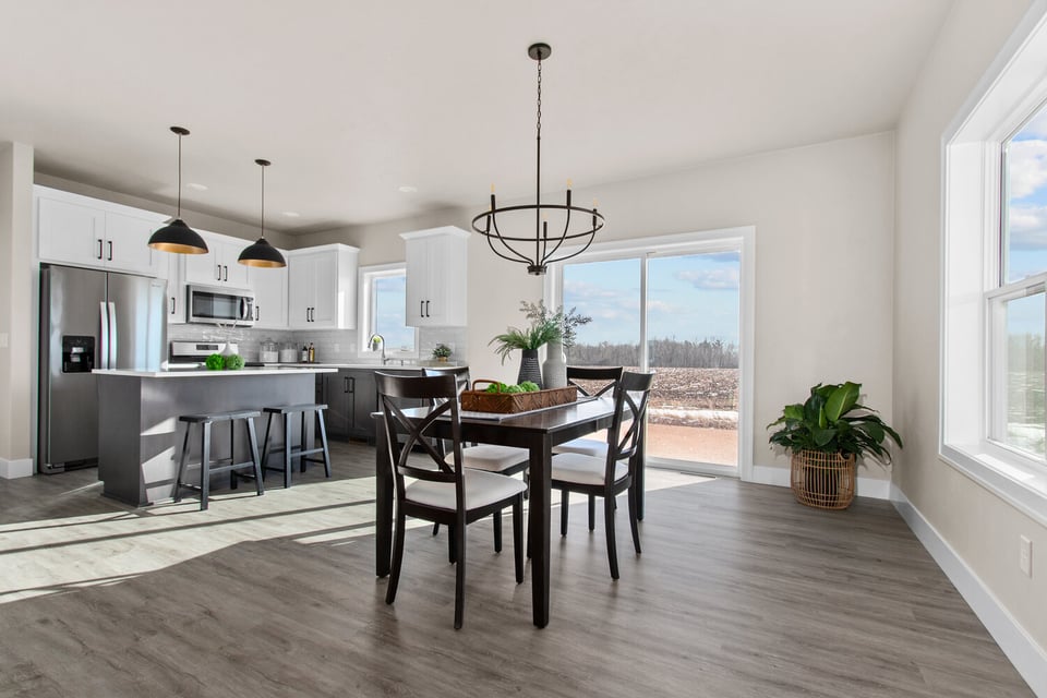 Open dining area with natural light and outdoor views by Midwest Design Homes in Fox Cities, WI