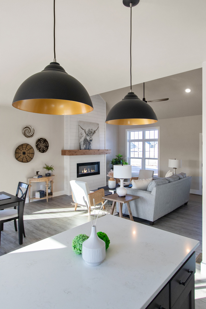 Open-concept living room with fireplace in custom home by Midwest Design Homes in Ledgeview, WI