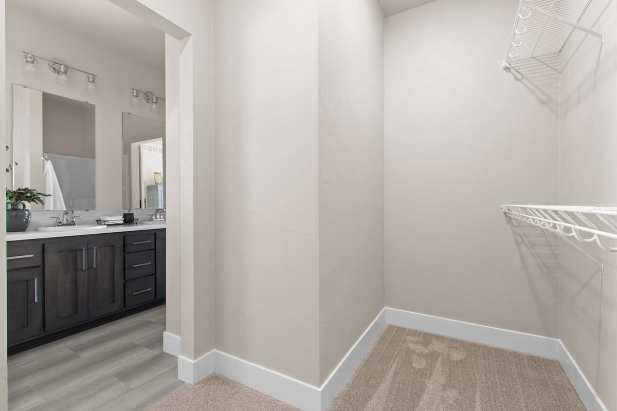 Walk-in closet entrance leading to master bathroom by Midwest Design Homes in Fox Cities, WI