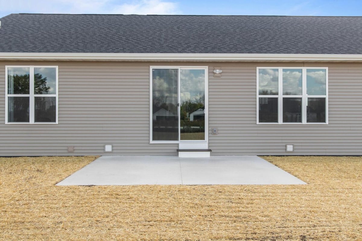 Close-up of sliding door and rear exterior wall in a custom home by Midwest Design Homes in Fox Cities, WI