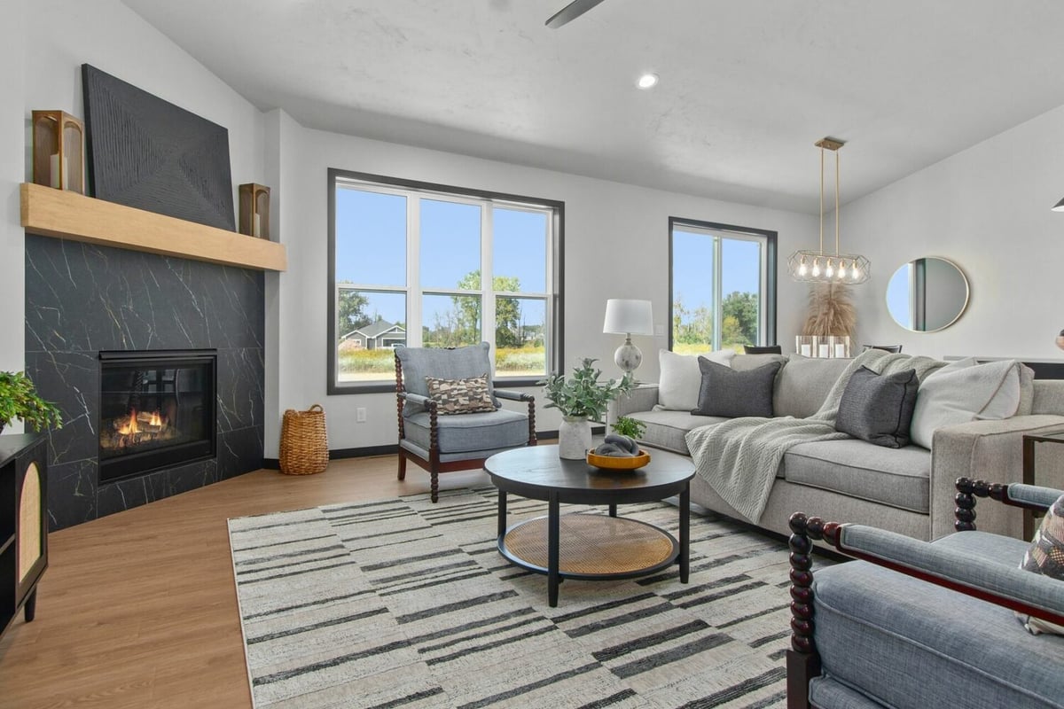 Contemporary living room with wood flooring by Midwest Design Homes in Kaukauna, WI