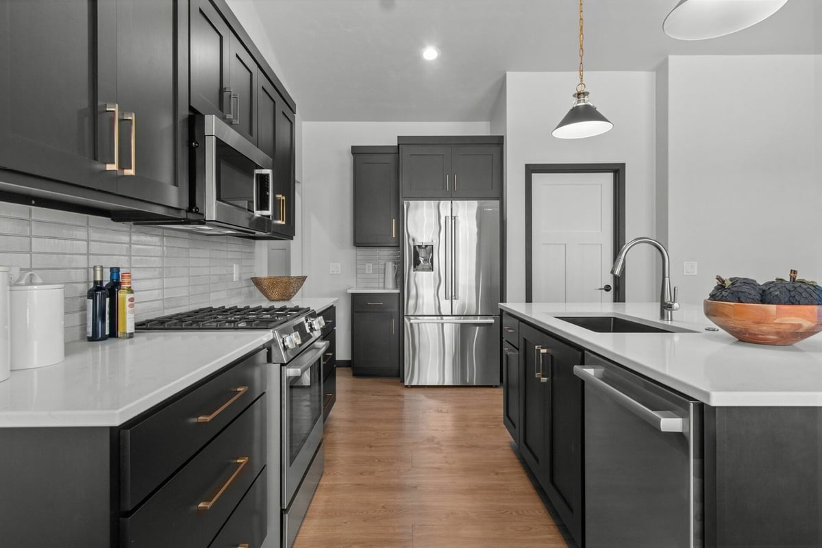 Elegant kitchen design with island sink by Midwest Design Homes in Harrison, WI
