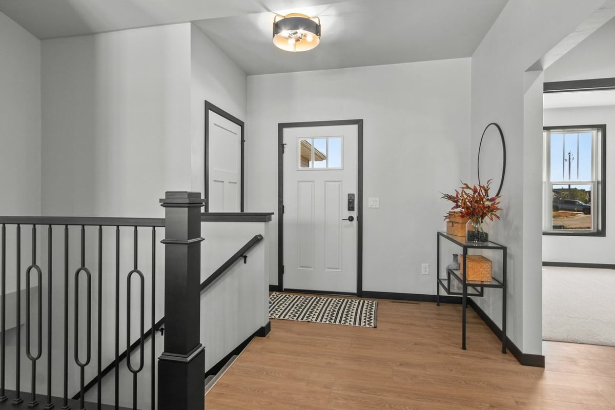 Entryway with modern black trim in custom home by Midwest Design Homes in Green Bay, WI
