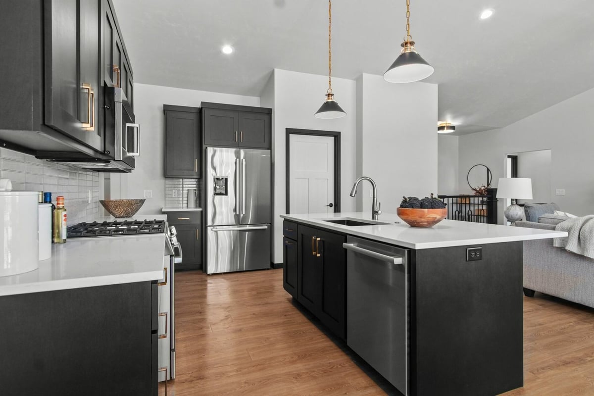 Kitchen with island and open layout in custom home by Midwest Design Homes in Fox Cities, WI