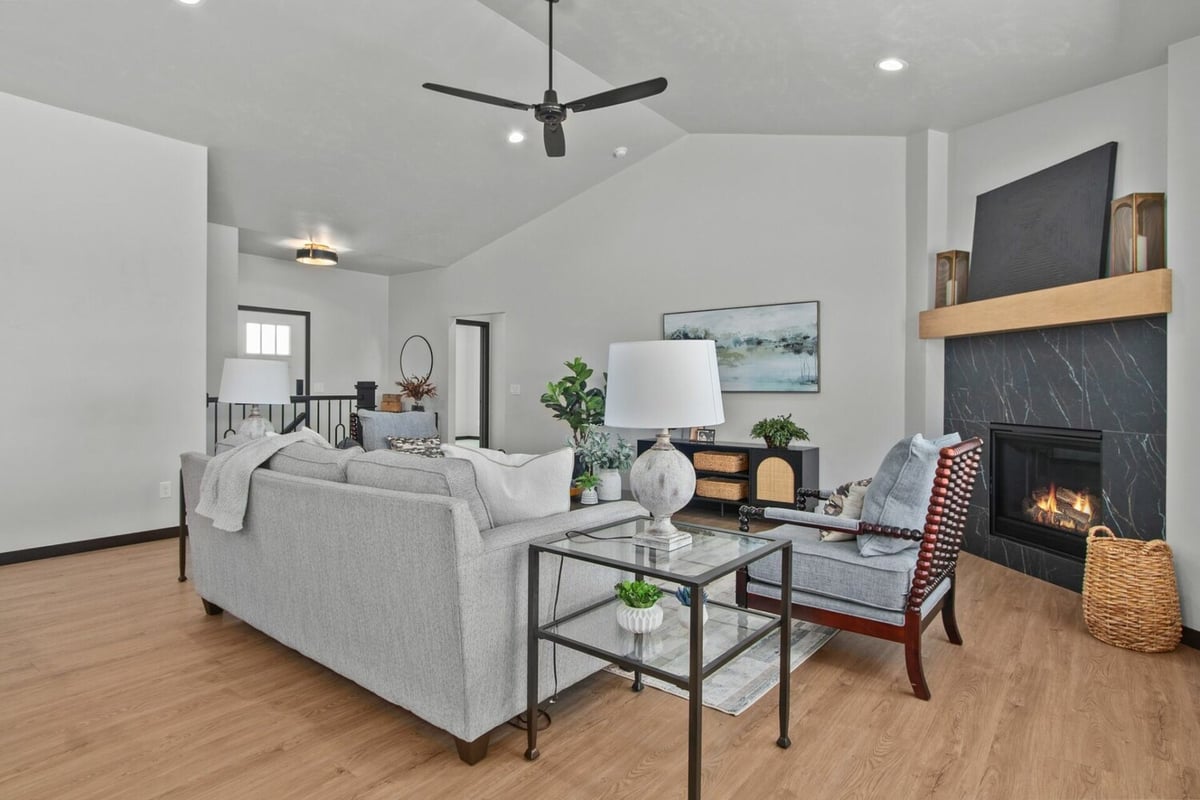 Living room with fireplace and modern decor by Midwest Design Homes in Green Bay, WI