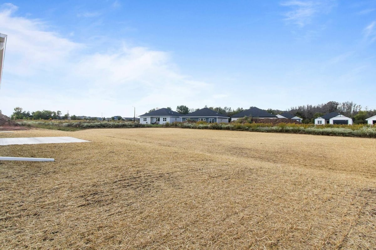 Open lot behind a custom home project by Midwest Design Homes in De Pere, WI