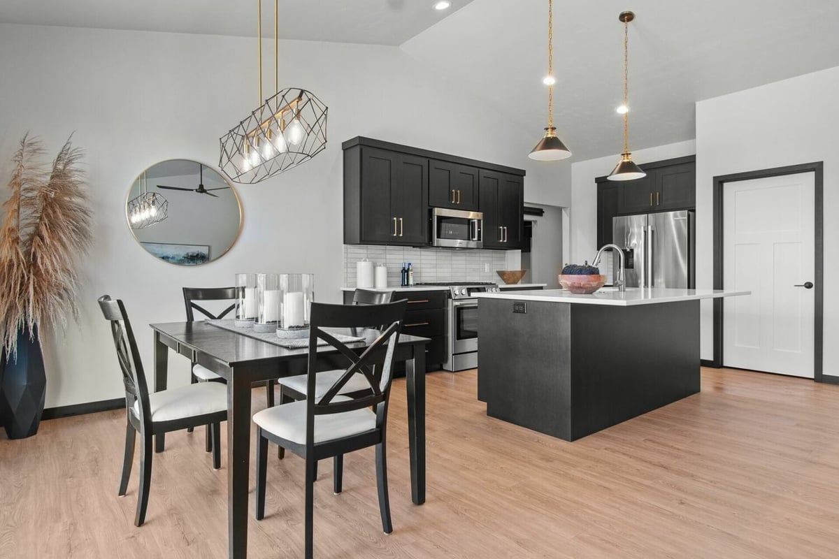 Open-concept dining and kitchen design by Midwest Design Homes in Ledgeview, WI