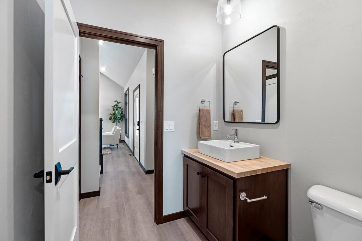Elegant bathroom renovation with natural wood finishes by Midwest Design Homes in Green Bay, WI.