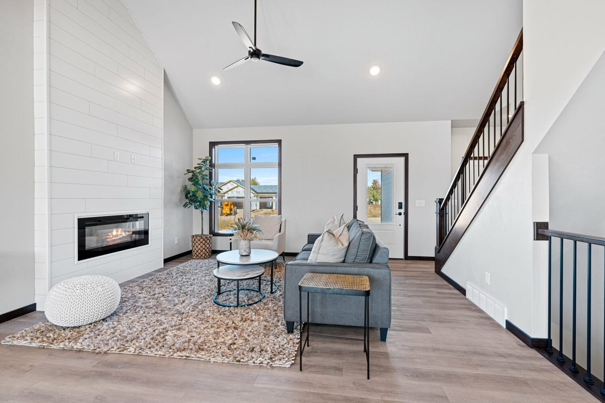Interior shot of cozy living room featuring fireplace and modern furniture in a Wisconsin custom home.