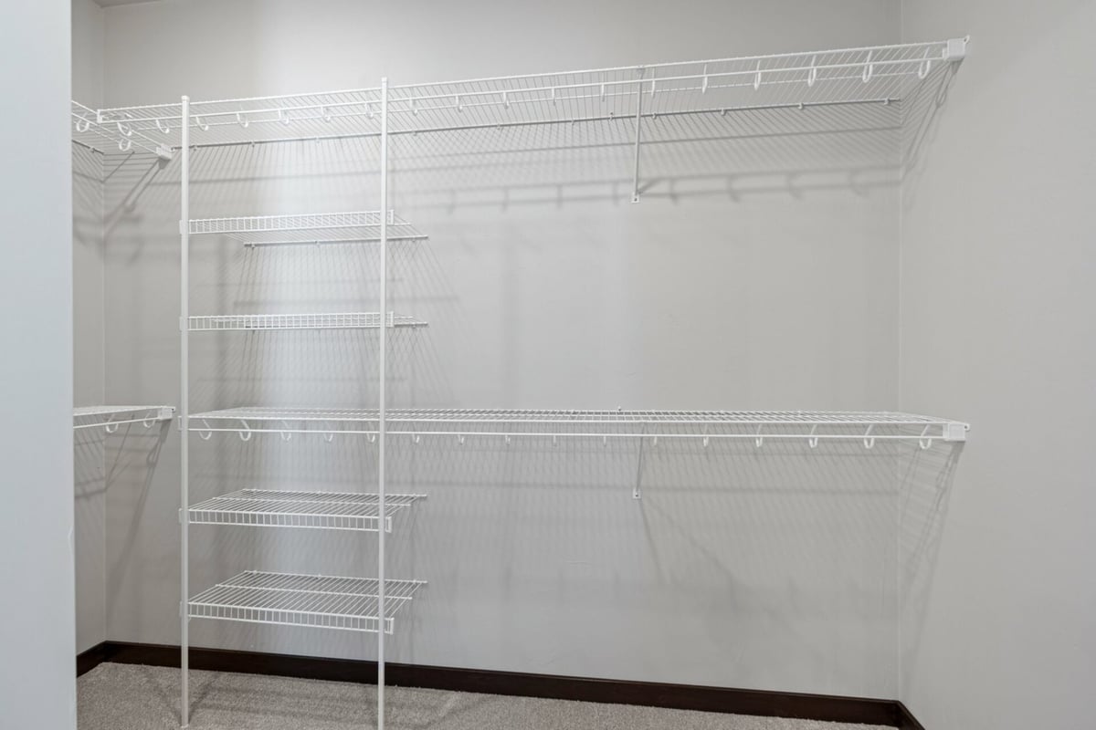 White wire shelving in a walk-in closet built by Midwest Design Homes in Fox Cities, WI.