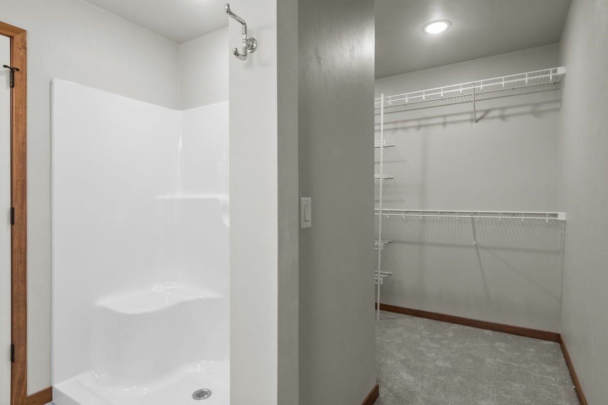Walk-in shower and spacious closet in new custom home by Midwest Design Homes in Fox Cities, WI