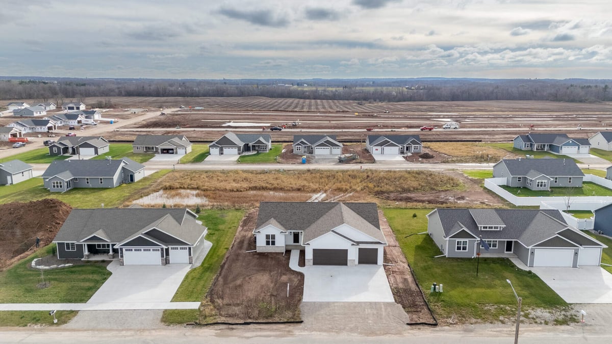 Aerial view of new residential community featuring custom home by Midwest Design Homes in Ellington, WI