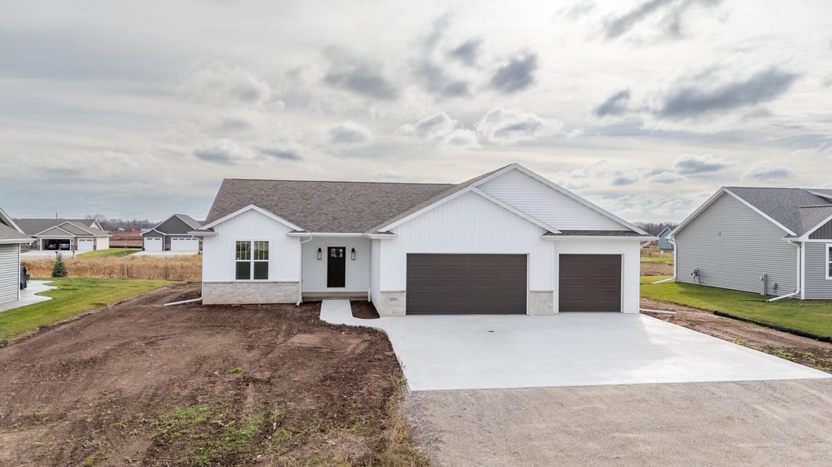 Newly completed custom ranch-style home with three-car garage by Midwest Design Homes in Kaukauna, WI
