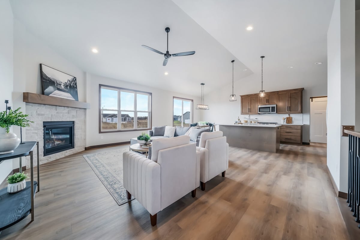 Open-concept living room and kitchen in a custom Kaukauna, WI home by Midwest Design Homes