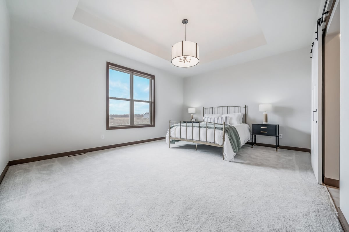 Spacious bedroom interior with clean finishes in Midwest Design Homes project in Fox Cities, WI