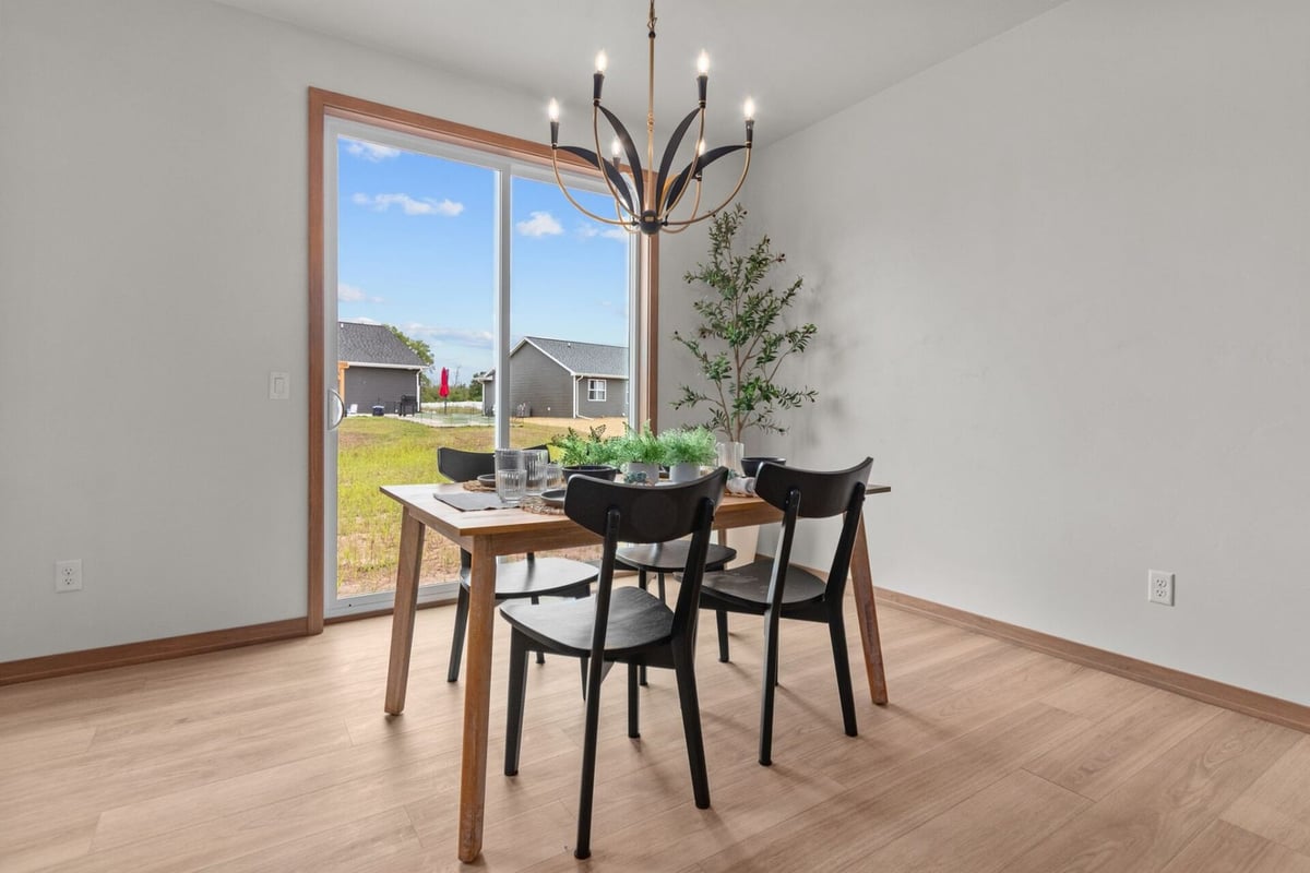 Dining area with backyard view in a custom-built home by Midwest Design Homes in Kaukauna, WI