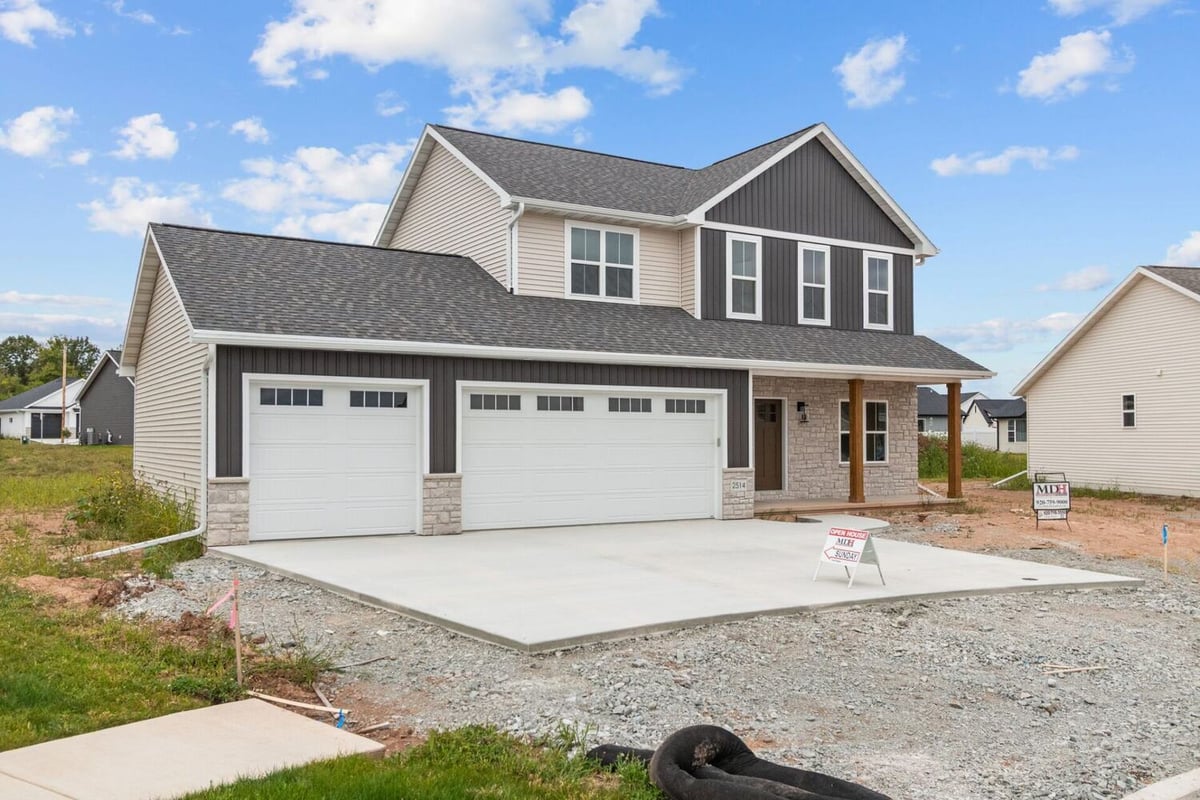 Newly constructed two-story custom home with triple garage by Midwest Design Homes in Harrison, WI