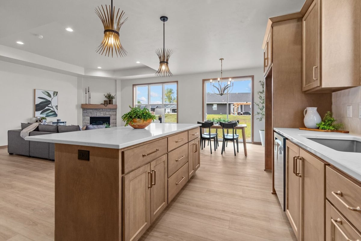 Open-concept kitchen and living area in a custom home by Midwest Design Homes in Green Bay, WI