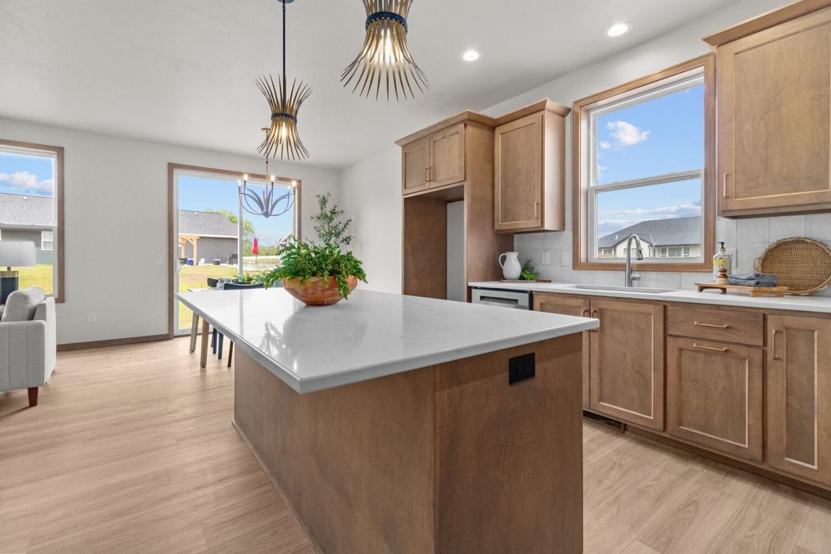 Wood cabinetry kitchen design in a Fox Cities custom home built by Midwest Design Homes