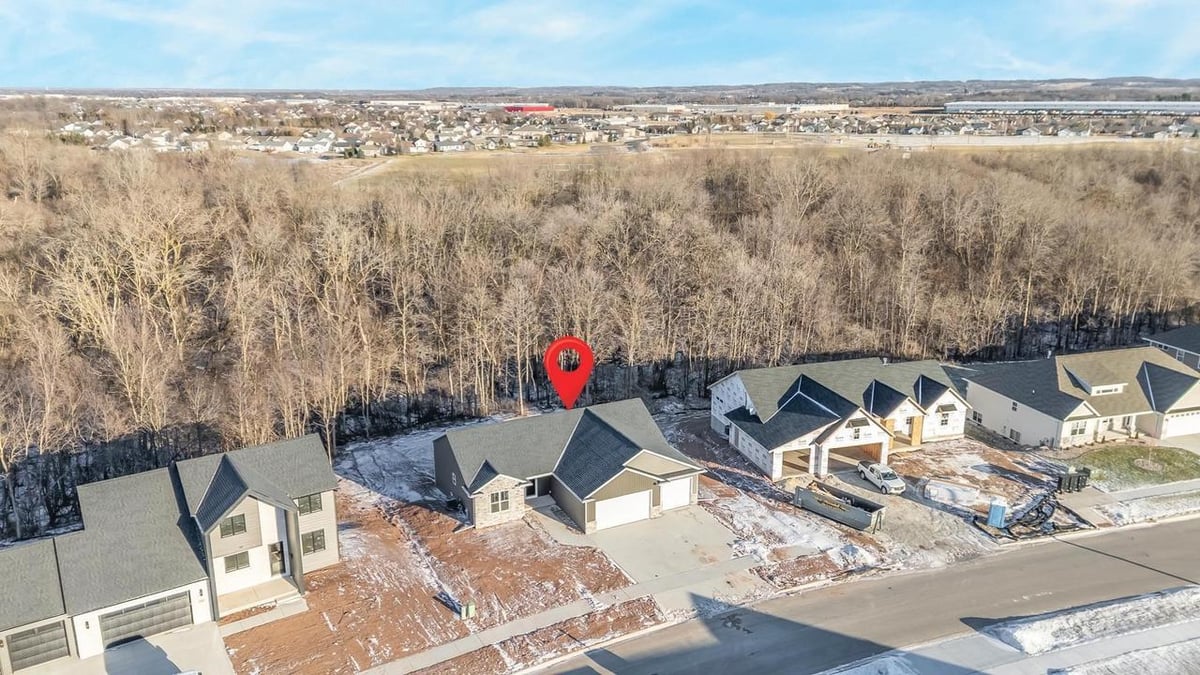 Aerial neighborhood view highlighting Fox Cities home near wooded area