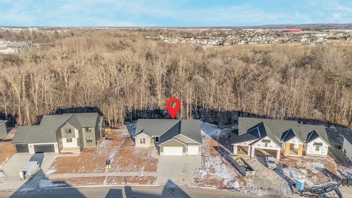 Aerial view of new construction home backing to woods in the Fox Cities neighborhood