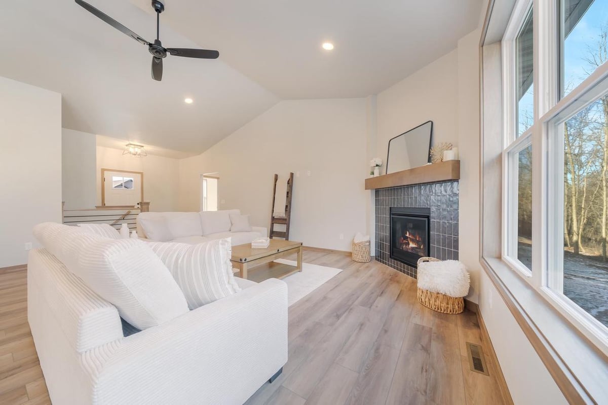 Bright living area with fireplace and large windows in the Fox Cities