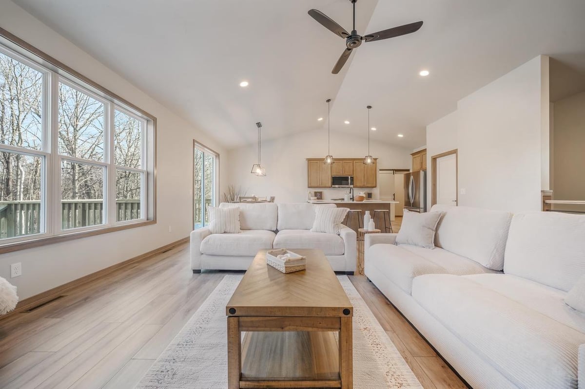 Bright living room with large windows, fireplace and vaulted ceiling in the Fox Cities