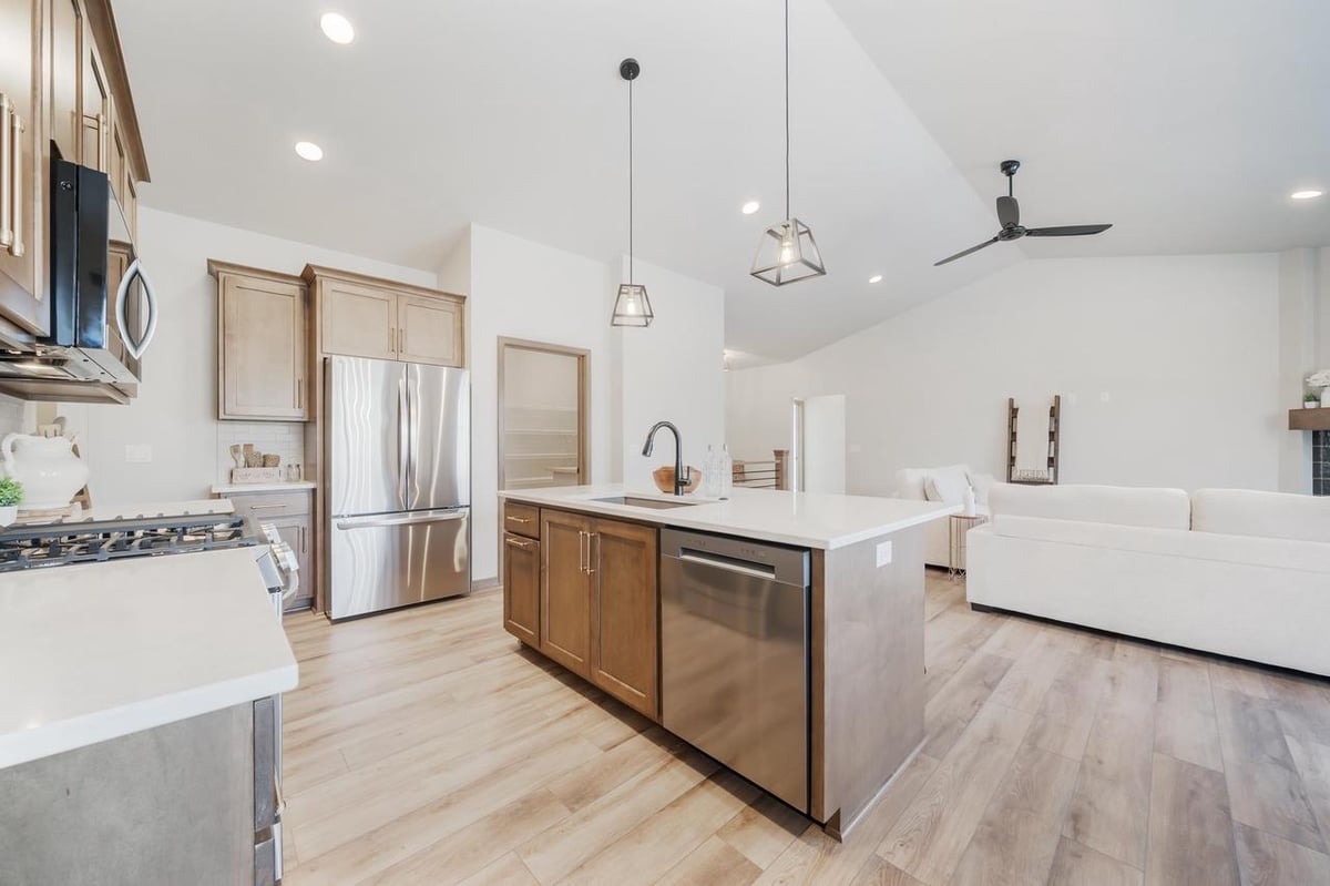 Open concept kitchen and living area with island seating in the Fox Cities