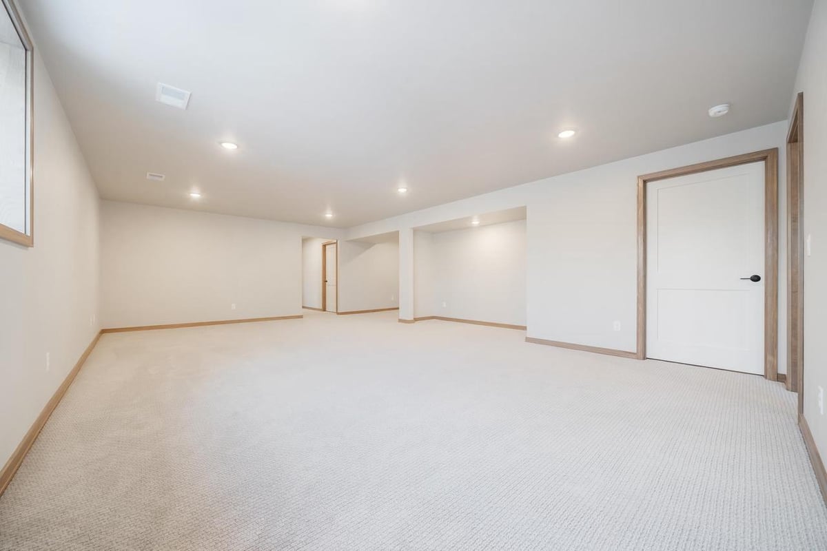 Open lower level layout with neutral finishes in the Fox Cities