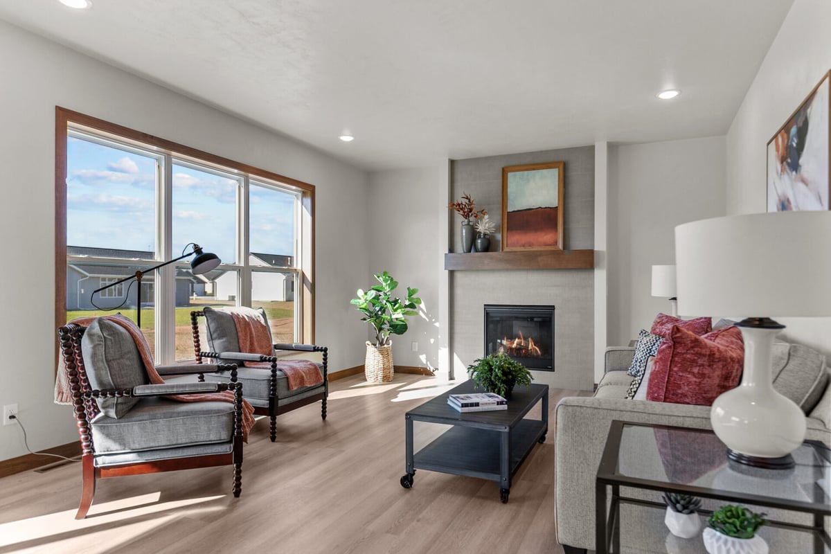 Modern living space with seating area and natural lighting in a Wisconsin custom home by Midwest Design Homes
