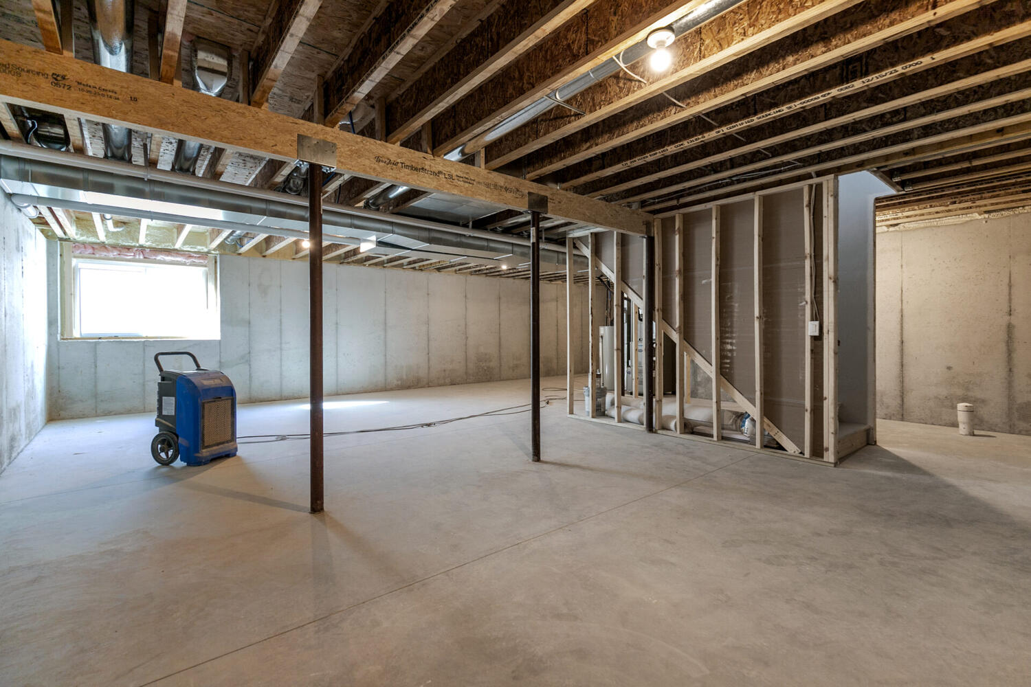 Open basement layout under construction in a new custom build by Midwest Design Homes in Wisconsin