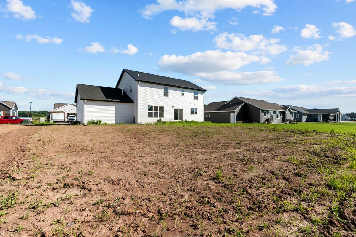 Rear exterior of two-story custom home under construction in Greenville, WI by Midwest Design Homes
