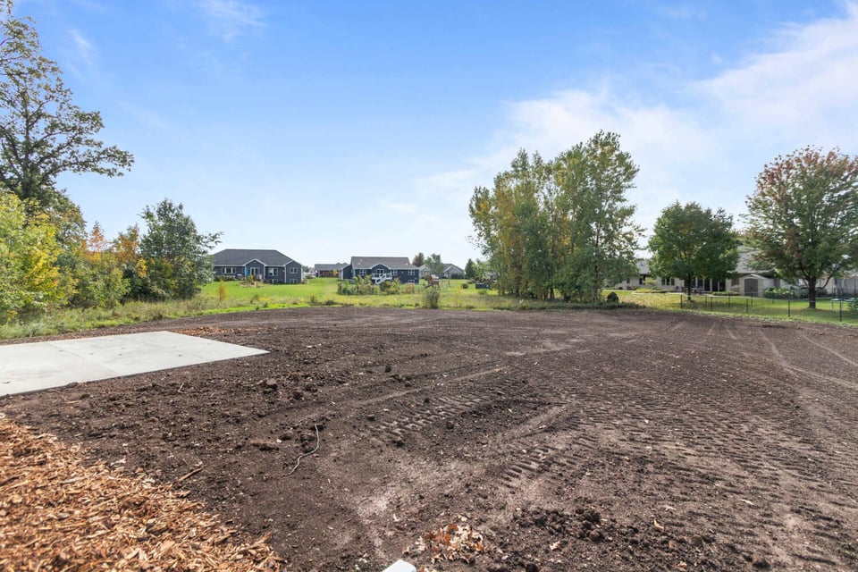 Large backyard lot prepared for landscaping in a custom home by Midwest Design Homes in Harrison, WI