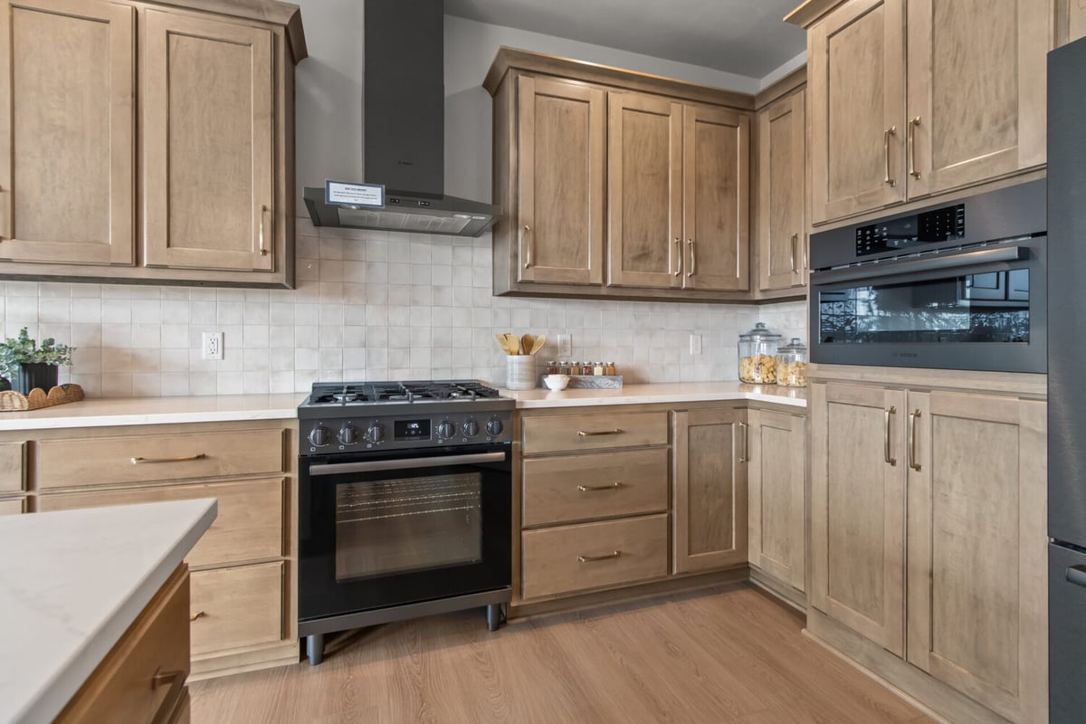Stainless appliances and sleek cabinetry in a Midwest Design Homes kitchen in Fremont, WI